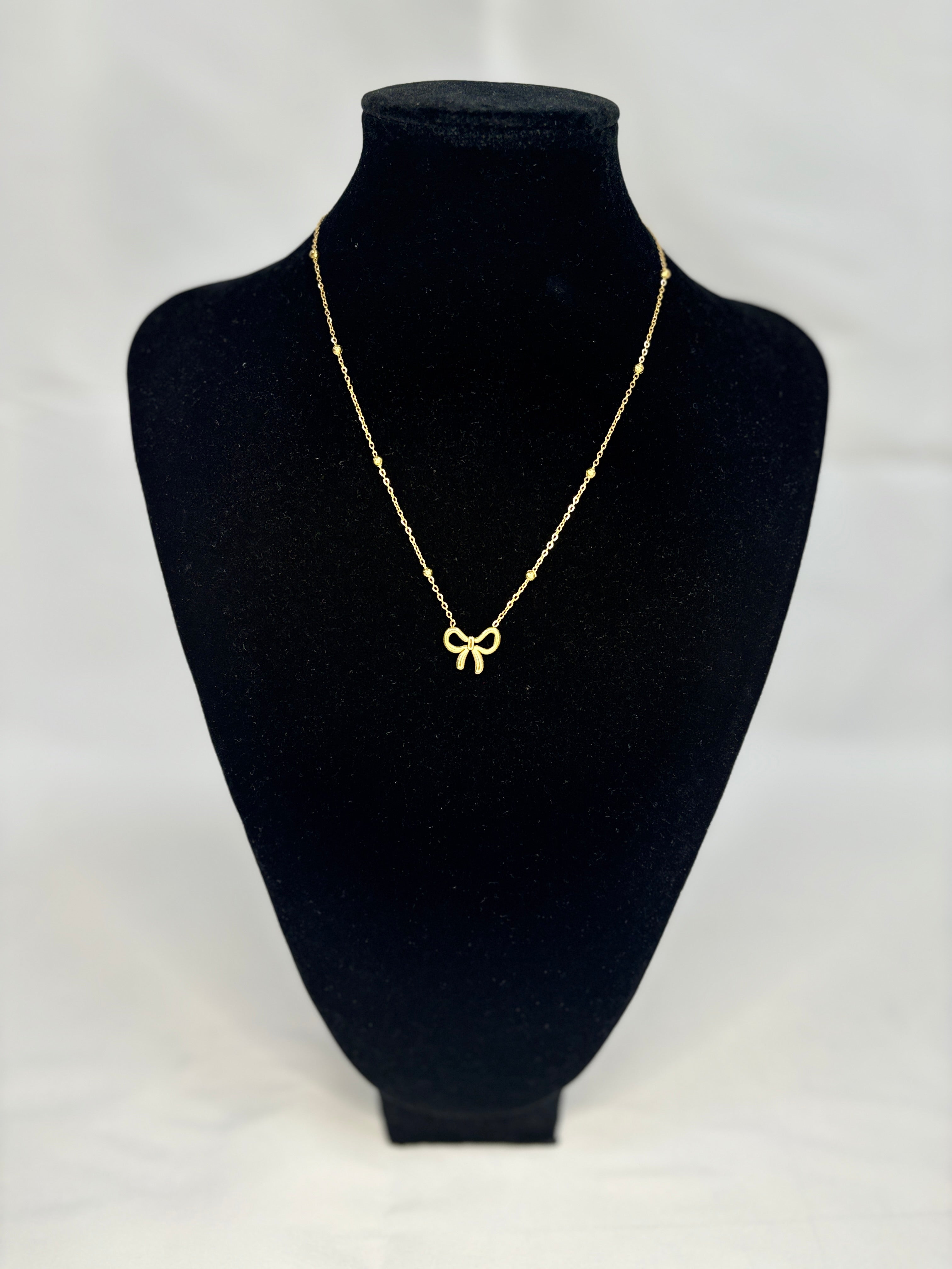 GOLD BOW NECKLACE
